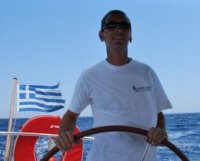 A Greek Sails skipper helms although the team flake out, enjoying their cruising getaway