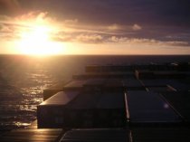 sunset sunrise from deck of freighter cargo ship